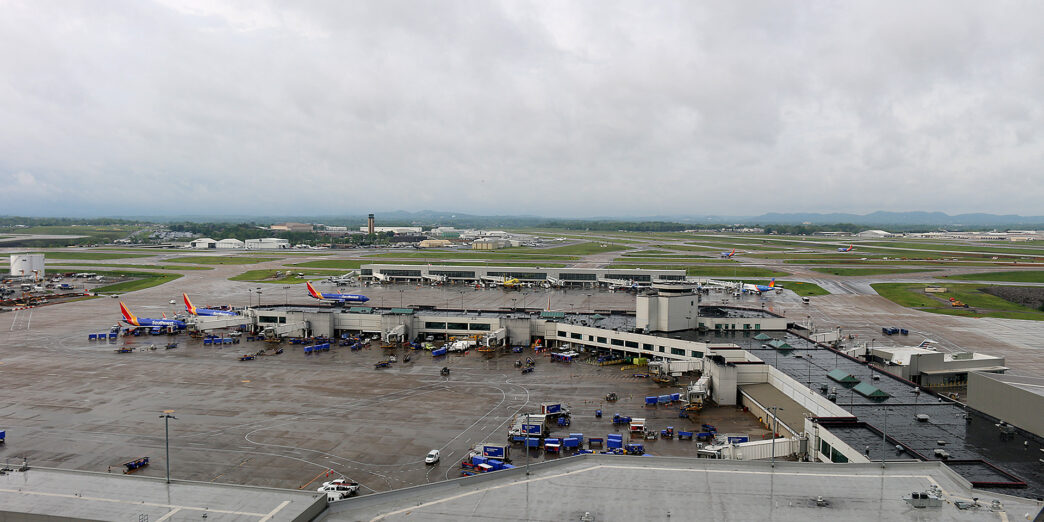 an airport with planes parked on the ground
