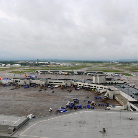 an airport with planes parked on the ground