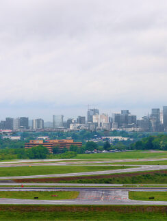 a runway with a city in the background