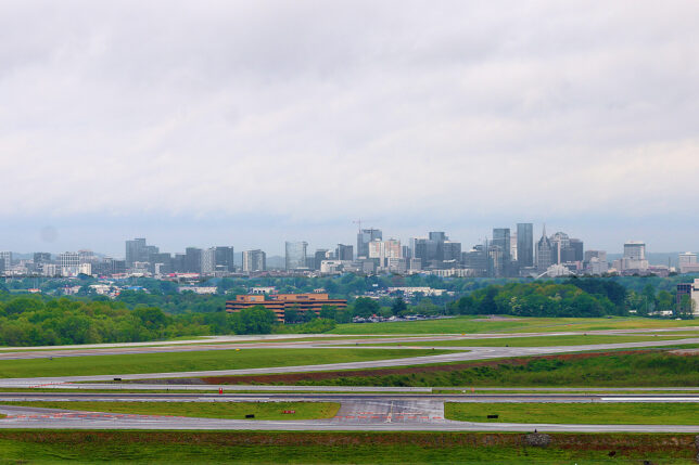 a runway with a city in the background