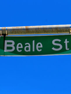 a green street sign with white text