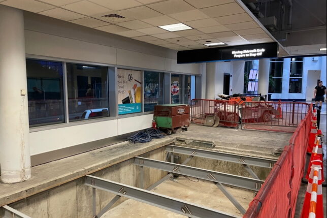 a building with a large hole in the ground