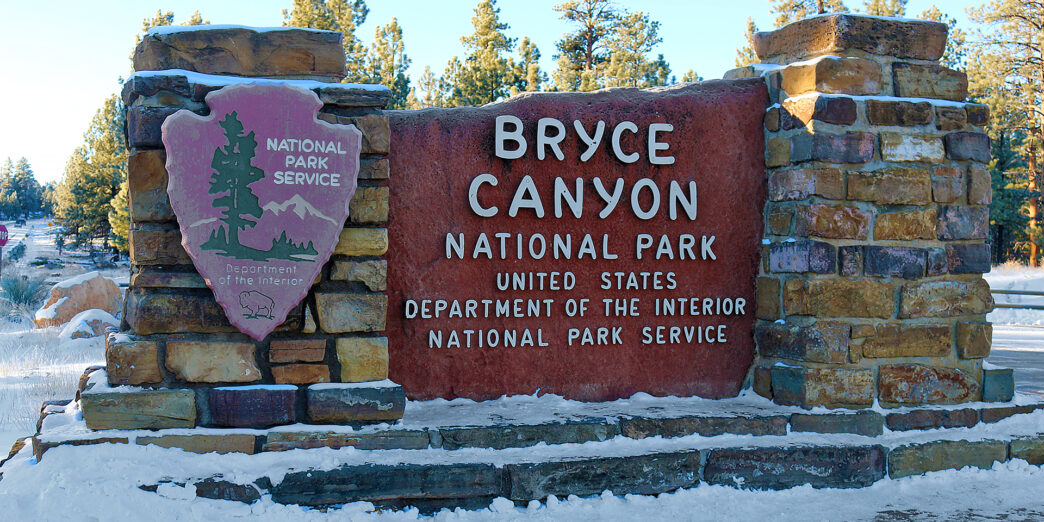 a sign at a entrance to a park