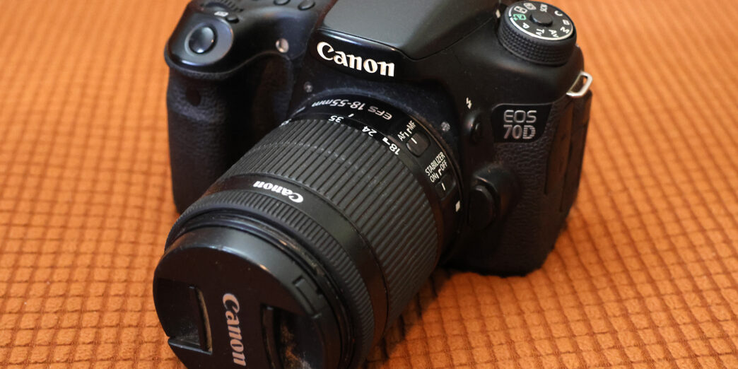 a black camera with a lens