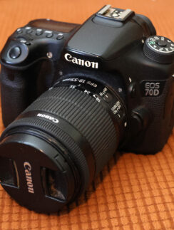 a black camera with a lens