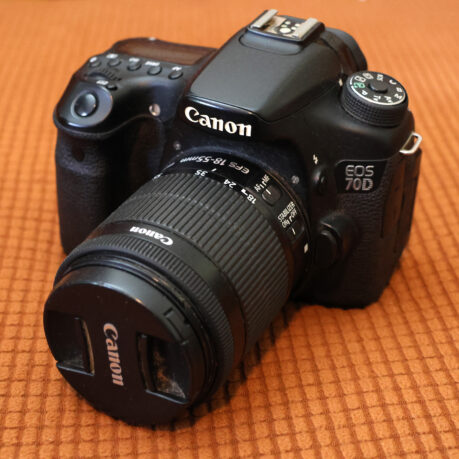 a black camera with a lens