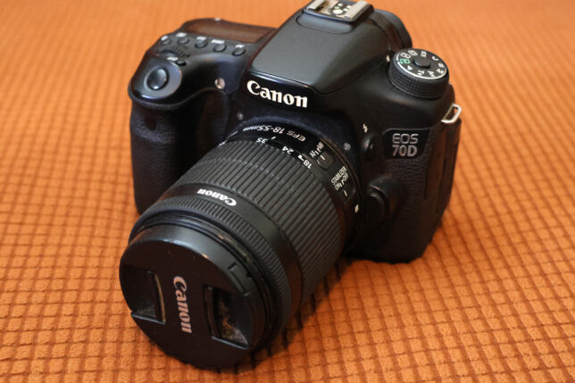 a black camera with a lens