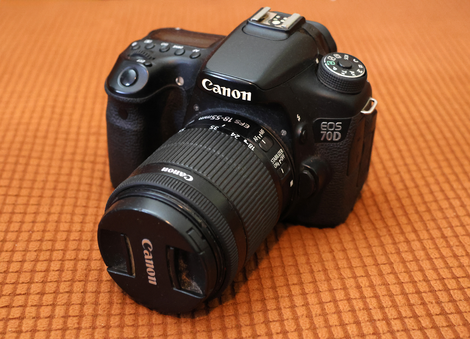 a black camera with a lens