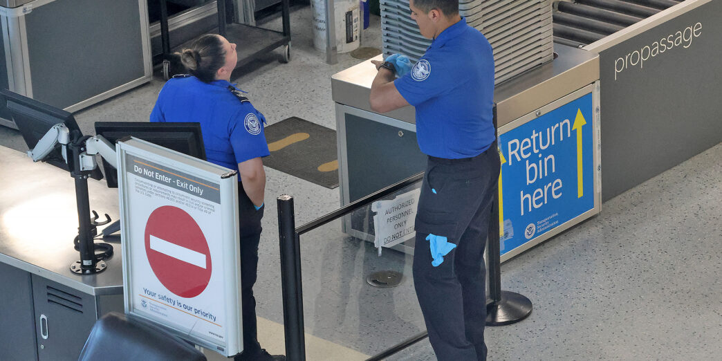 a man and woman standing in a line