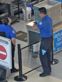 a man and woman standing in a line