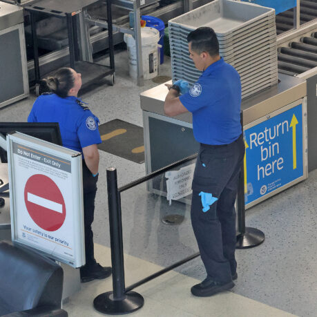 a man and woman standing in a line