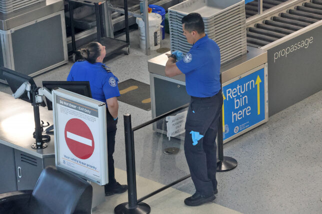 a man and woman standing in a line