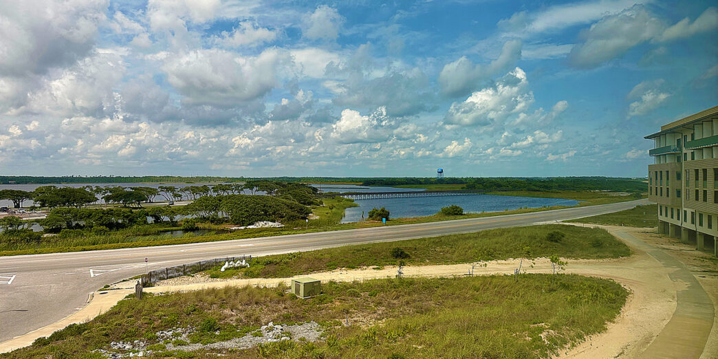 a road with a bridge over water