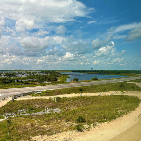 a road with a bridge over water