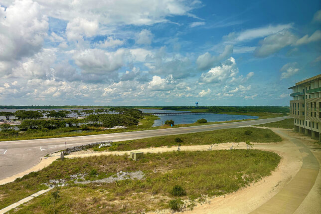 a road with a bridge over water