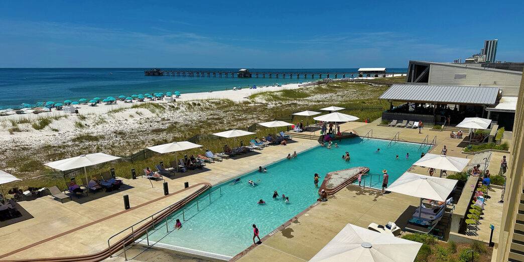 a pool with people swimming in it