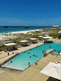 a pool with people swimming in it
