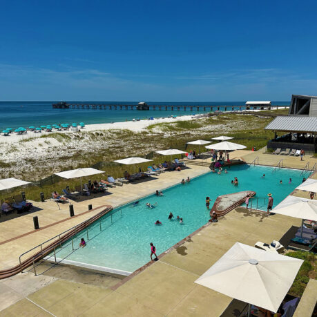 a pool with people swimming in it