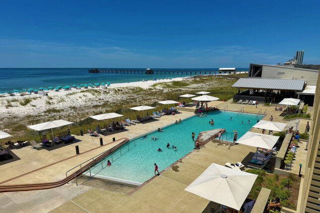 a pool with people swimming in it