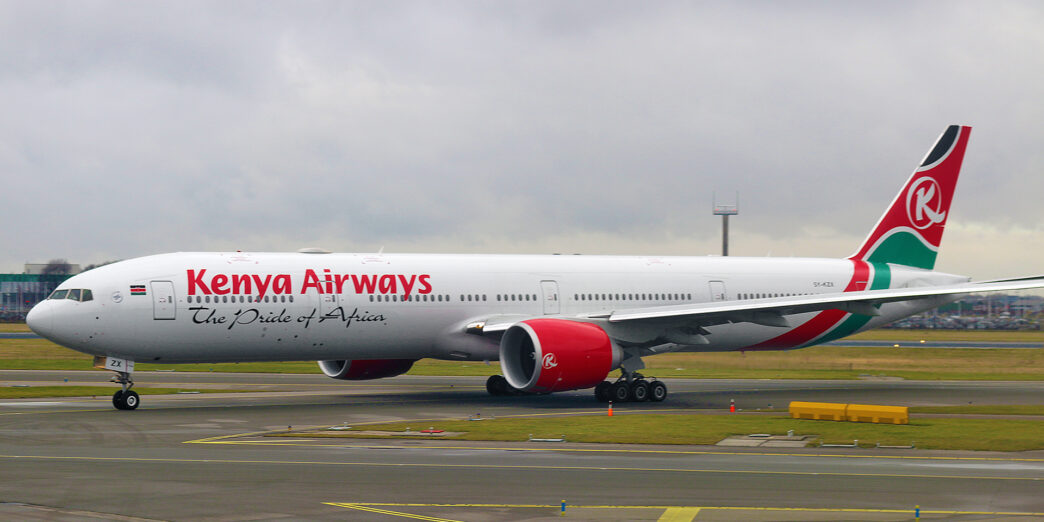 a large white airplane on a runway
