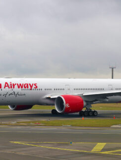 a large white airplane on a runway