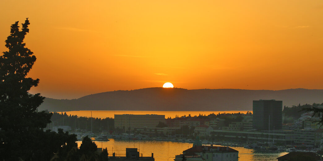 a sunset over a city