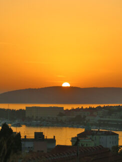 a sunset over a city