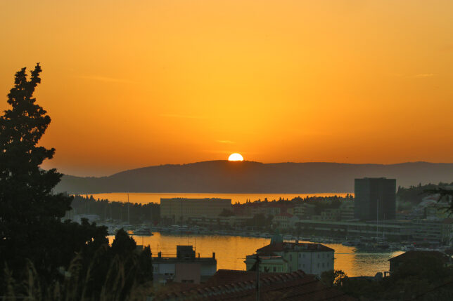 a sunset over a city