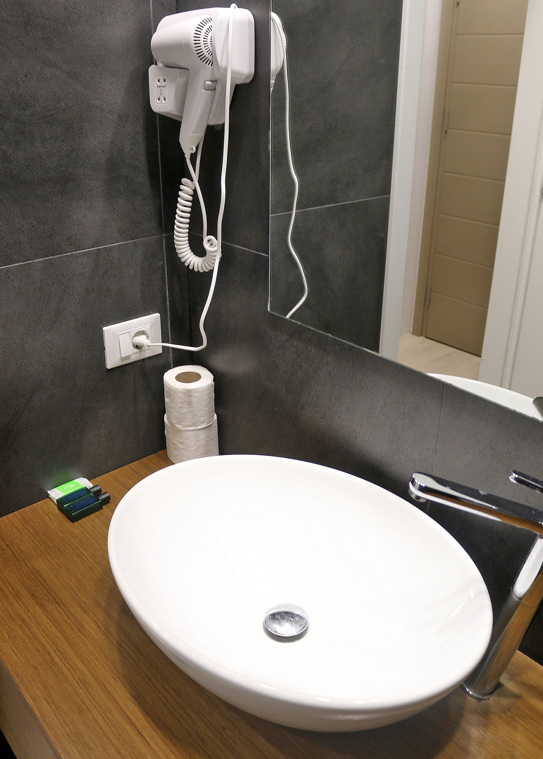 a bathroom with a sink and a hair dryer