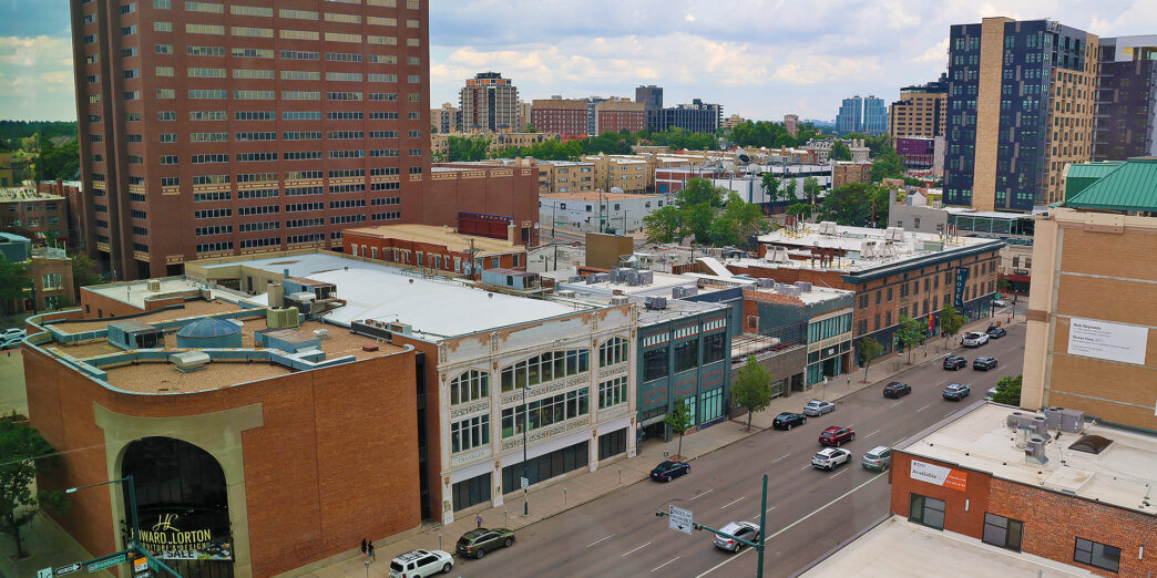 a city street with cars and buildings