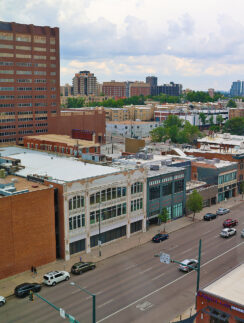 a city street with cars and buildings