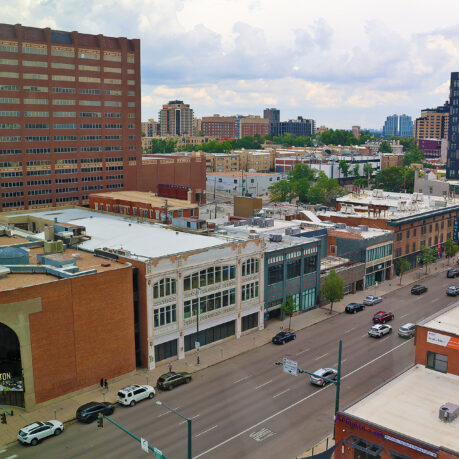a city street with cars and buildings