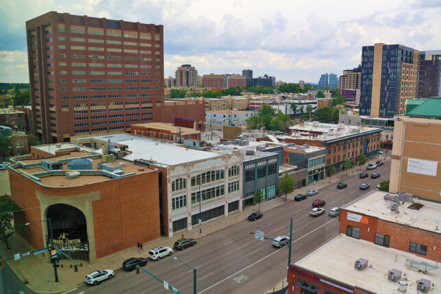 a city street with cars and buildings