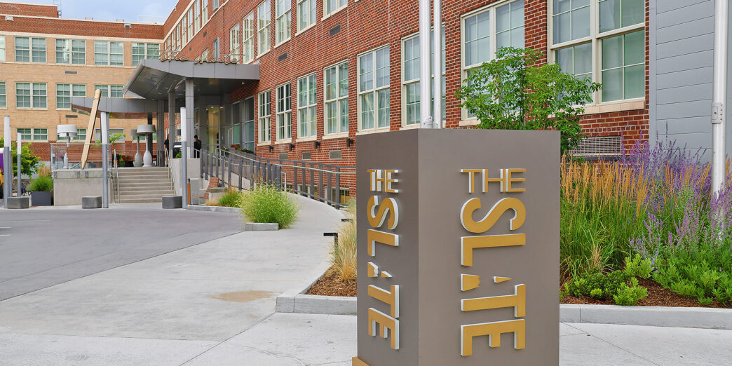 a sign in front of a building