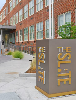 a sign in front of a building