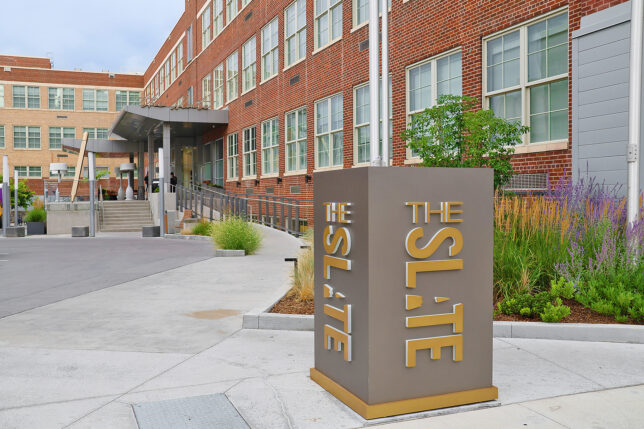 a sign in front of a building