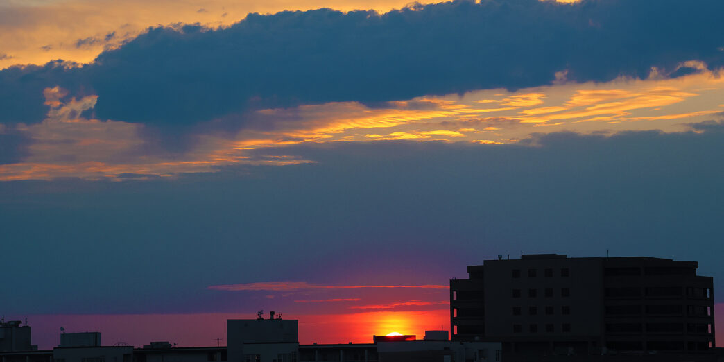 a sunset over a city