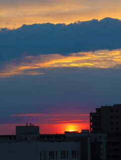 a sunset over a city