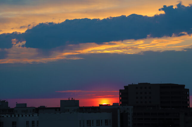 a sunset over a city
