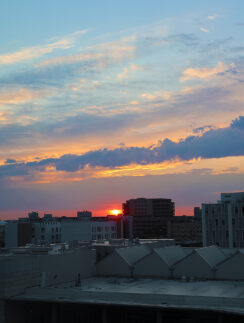 a sunset over a city
