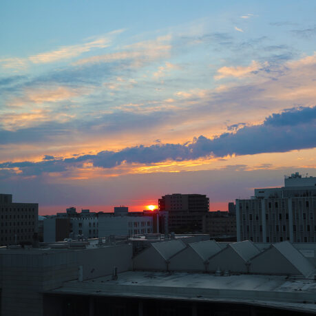 a sunset over a city