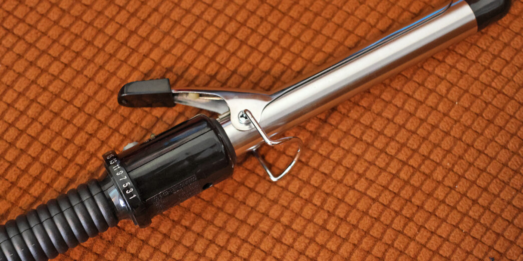 a curling iron on a carpet