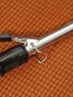 a curling iron on a carpet