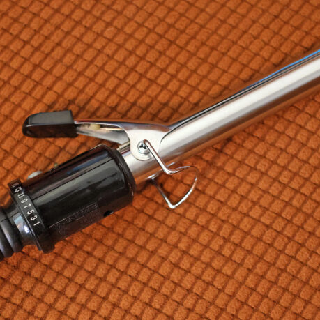 a curling iron on a carpet