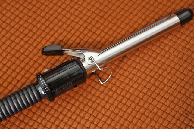 a curling iron on a carpet