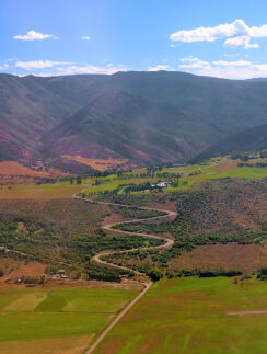 a winding road through a valley