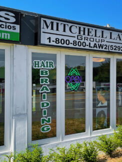 a store front with signs on windows