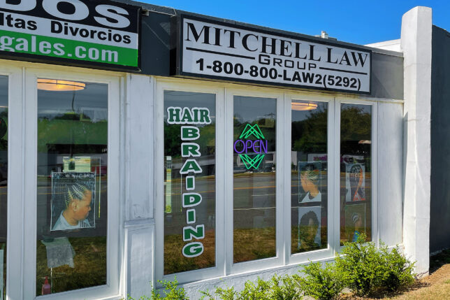 a store front with signs on windows