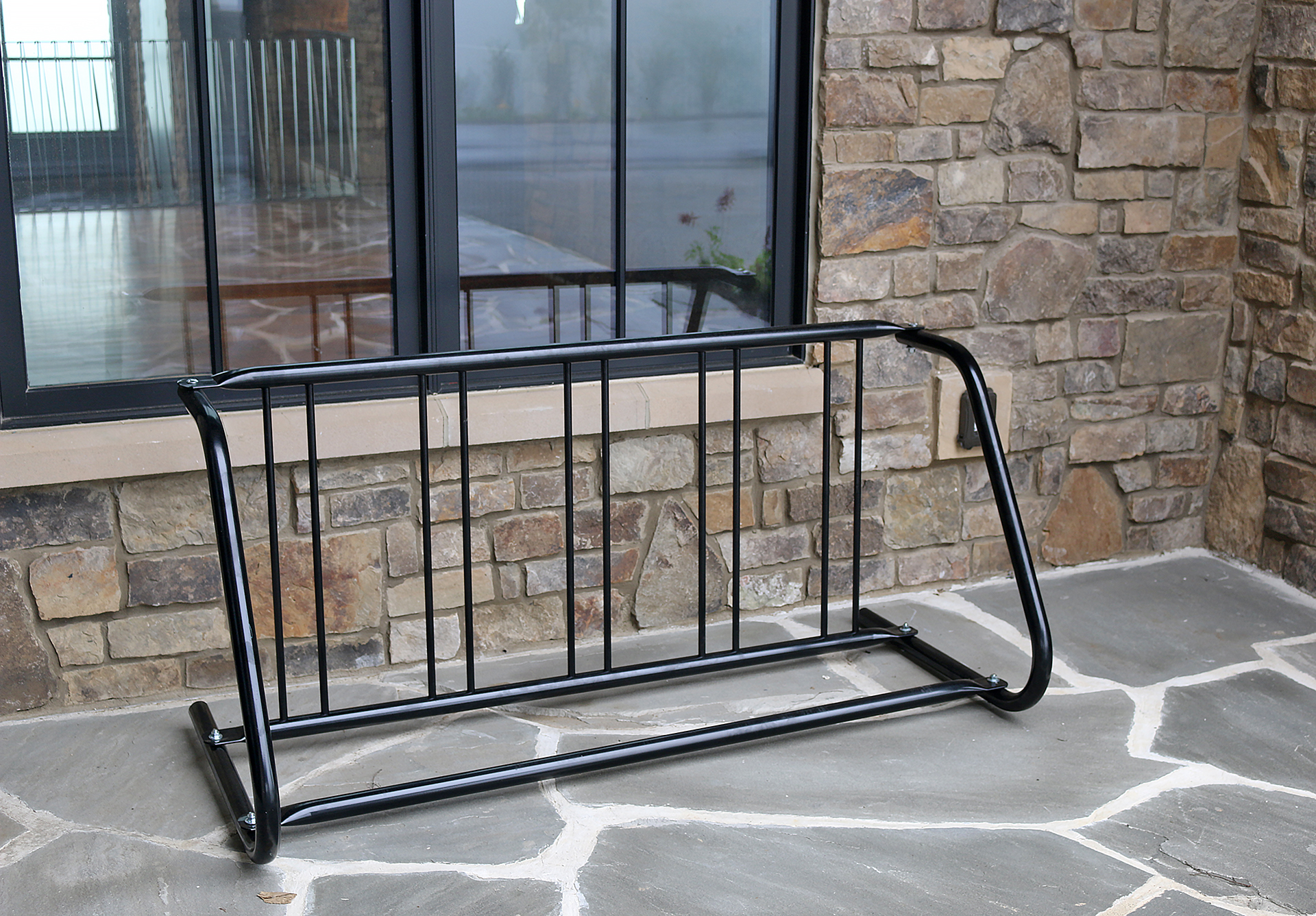 a bicycle rack on a stone surface
