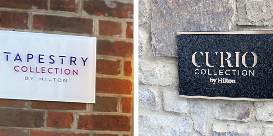 a sign on a brick wall